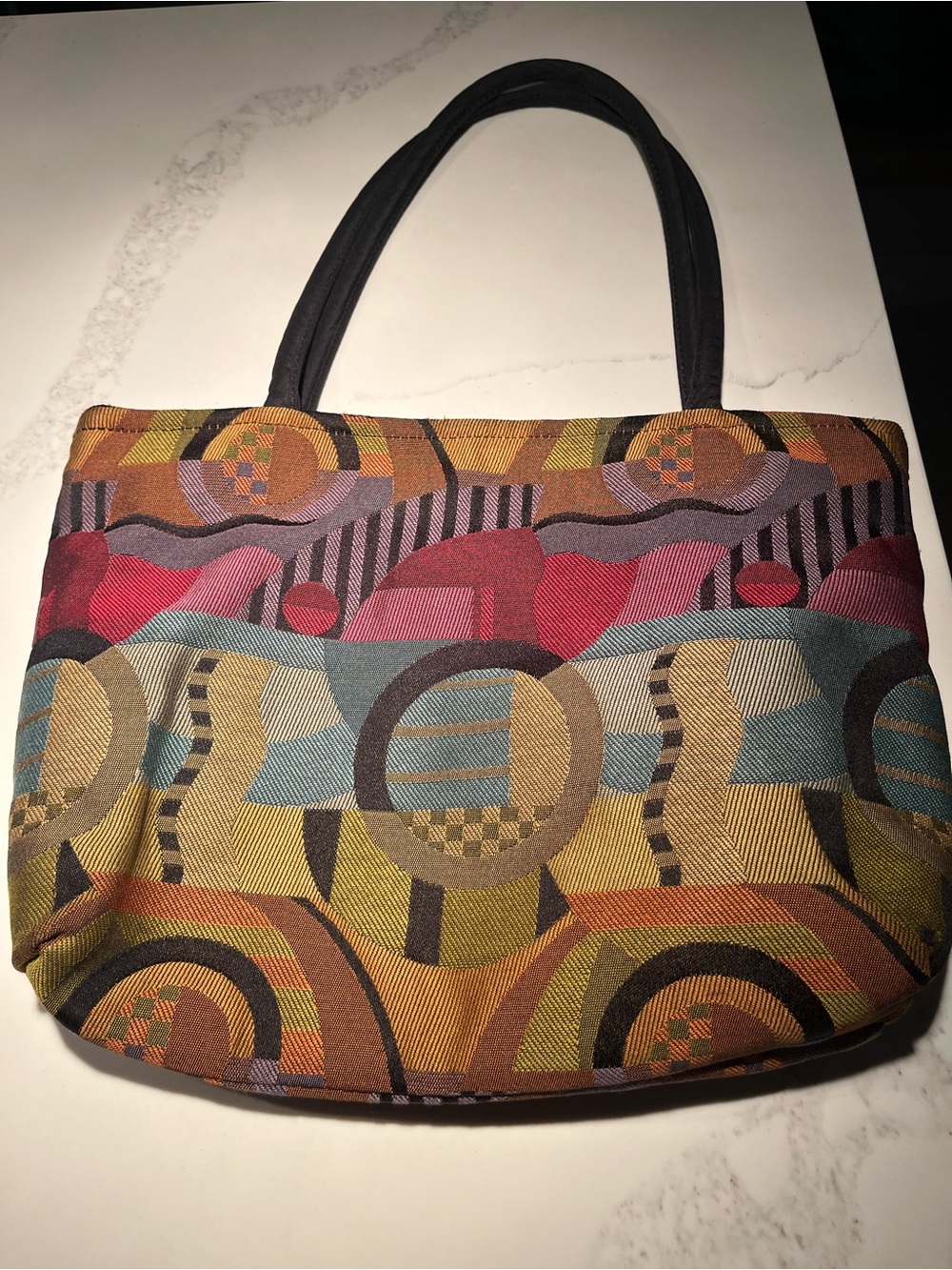 Beautiful fabric shoulder bag made by great bags.  Inside zippered pocket.